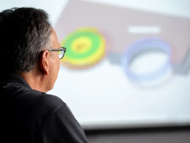 guy-looking-at-images-on-screen