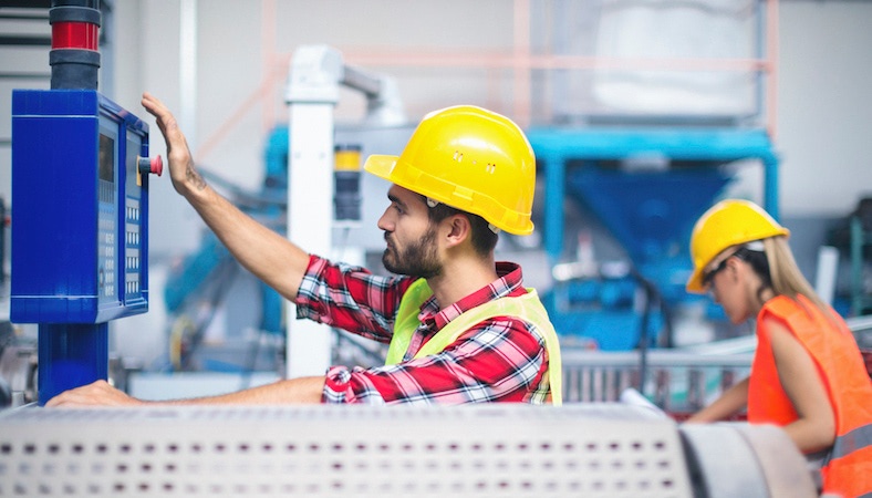 Worker at Injection Molding Machine