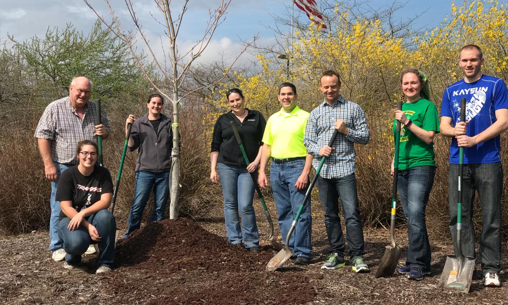 Kaysun team planting trees for Arbor Day