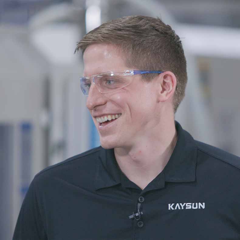 kaysun_employee_with_safety_glasses_smiling kaysun_employee_with_safety_glasses_smiling